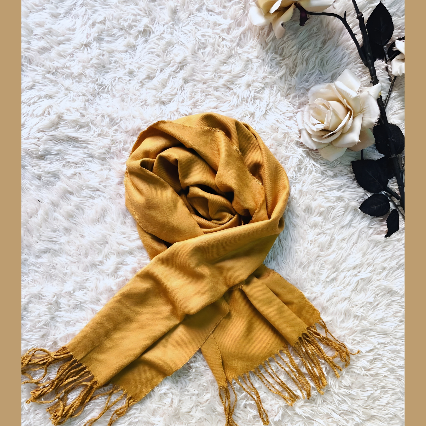 Women’s camel fashion scarf displayed with elegant fringes