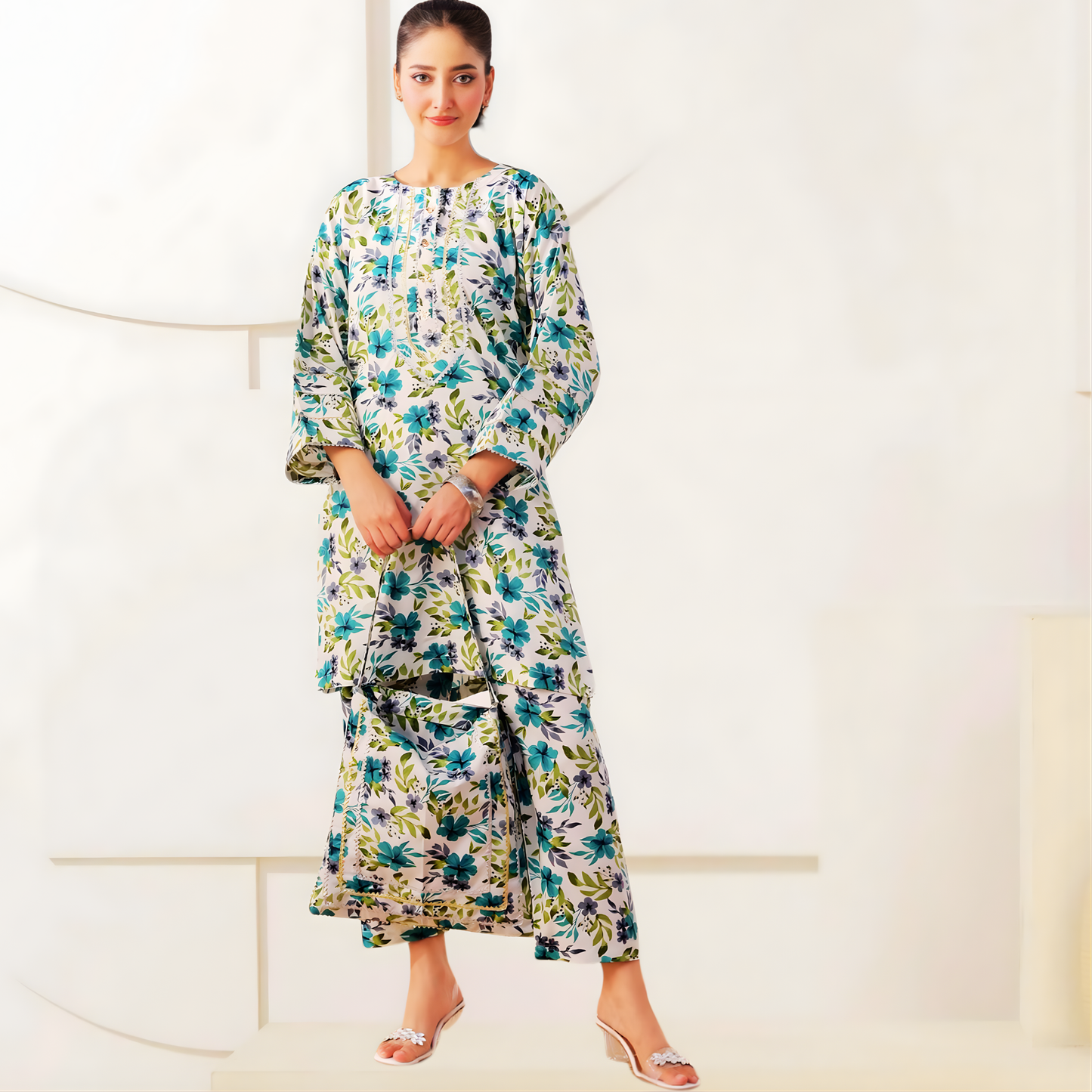 Elegant blue and green floral 3-piece Swiss fabric dress set by SEIN ATTIRE including printed shirt, trouser, and matching handbag.