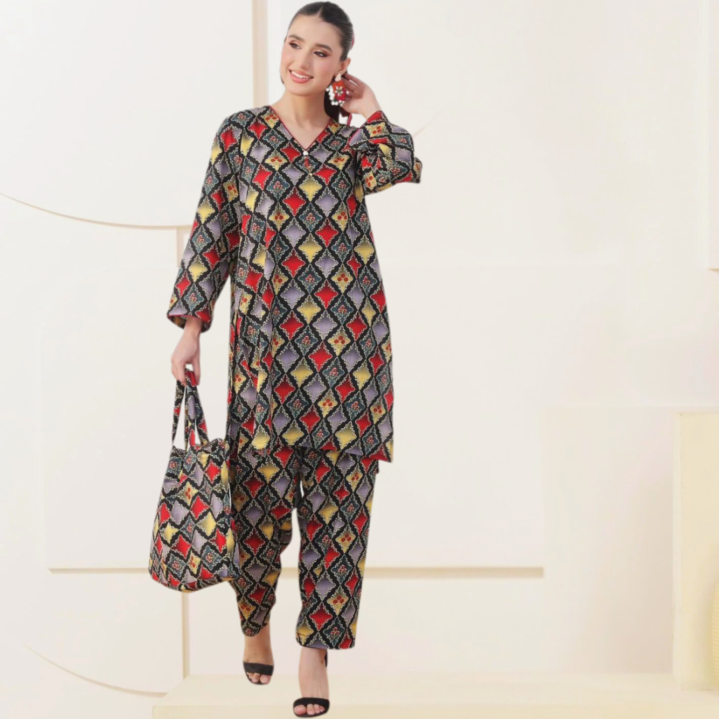 Colorful printed two-piece set with a matching handbag from SEIN ATTIRE, made in Swiss fabric for a chic modern look.
