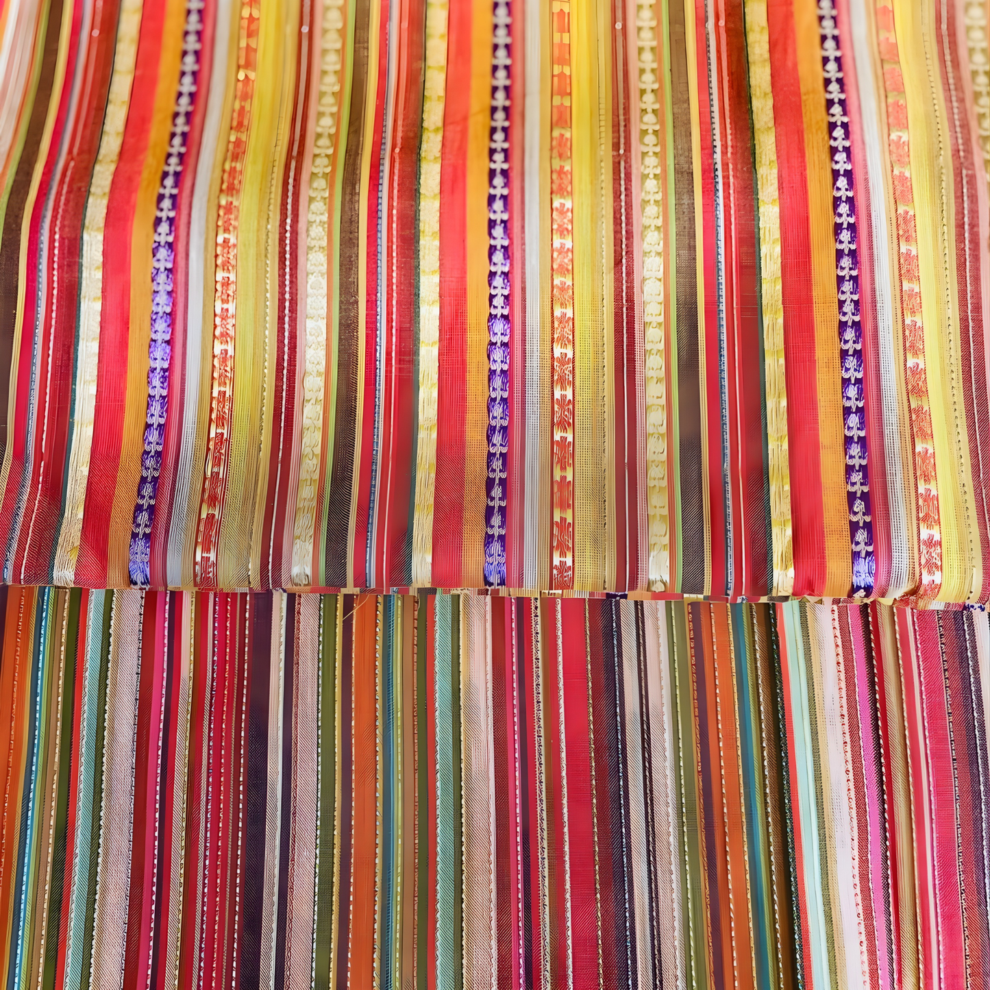 Premium striped designer fabric in rich multicolor tones with intricate jacquard patterns for eastern wear.