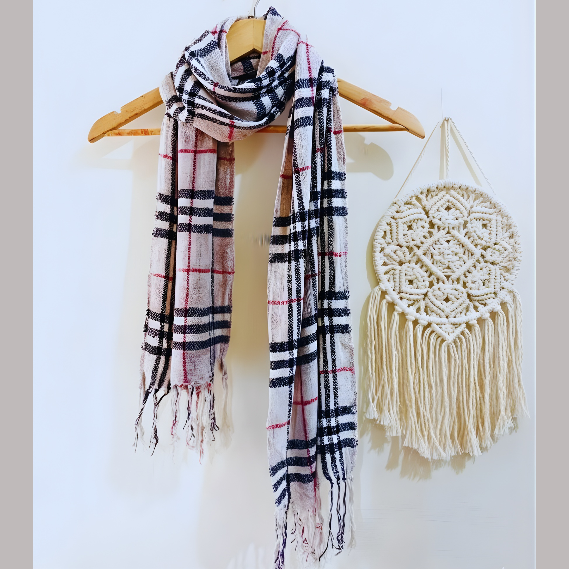 Premium velvet stole rolled neatly showing its warm winter texture and classic checkered design