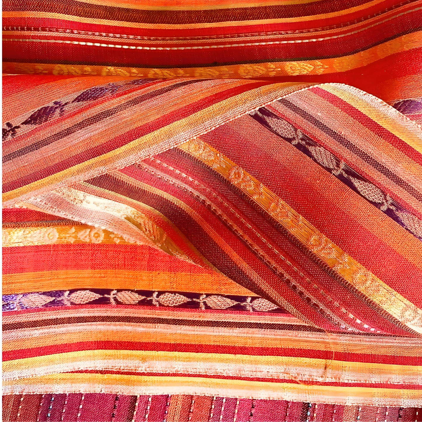Premium red and orange winter cotton fabric featuring colorful stripes and fine thread work.