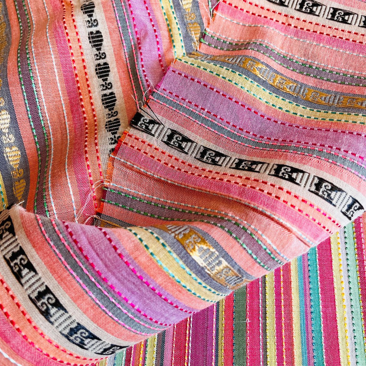 Premium unstitched 2-piece winter cotton suit showcasing vibrant striped design and woven jacquard work.