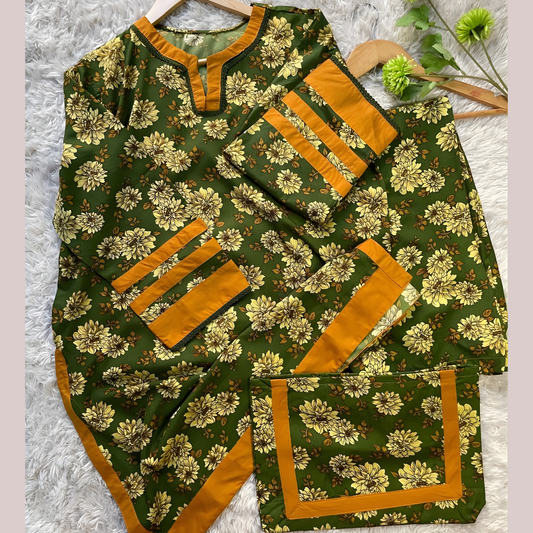 Ready-to-wear green floral printed outfit from SEIN ATTIRE, crafted from premium Swiss fabric with a coordinated printed handbag.