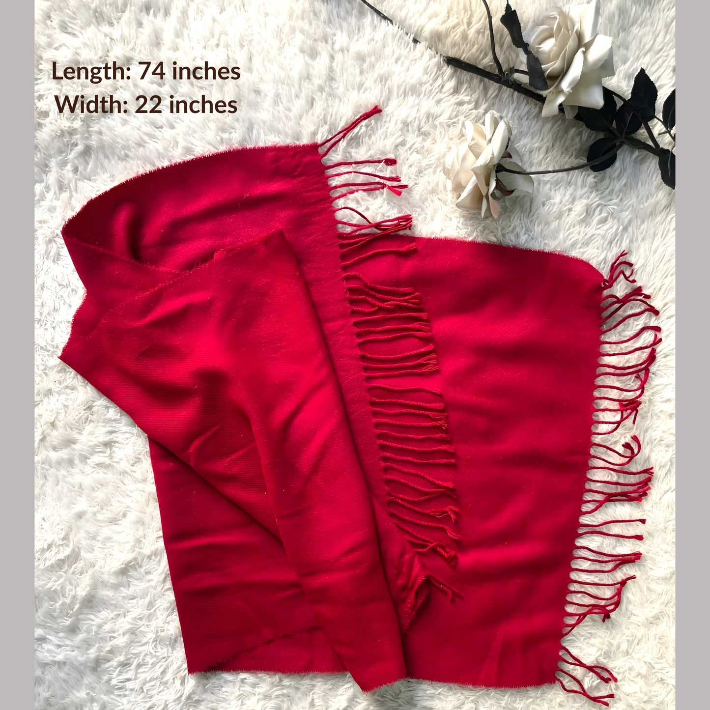 Women’s red shawl displayed on white fur background for winter wear